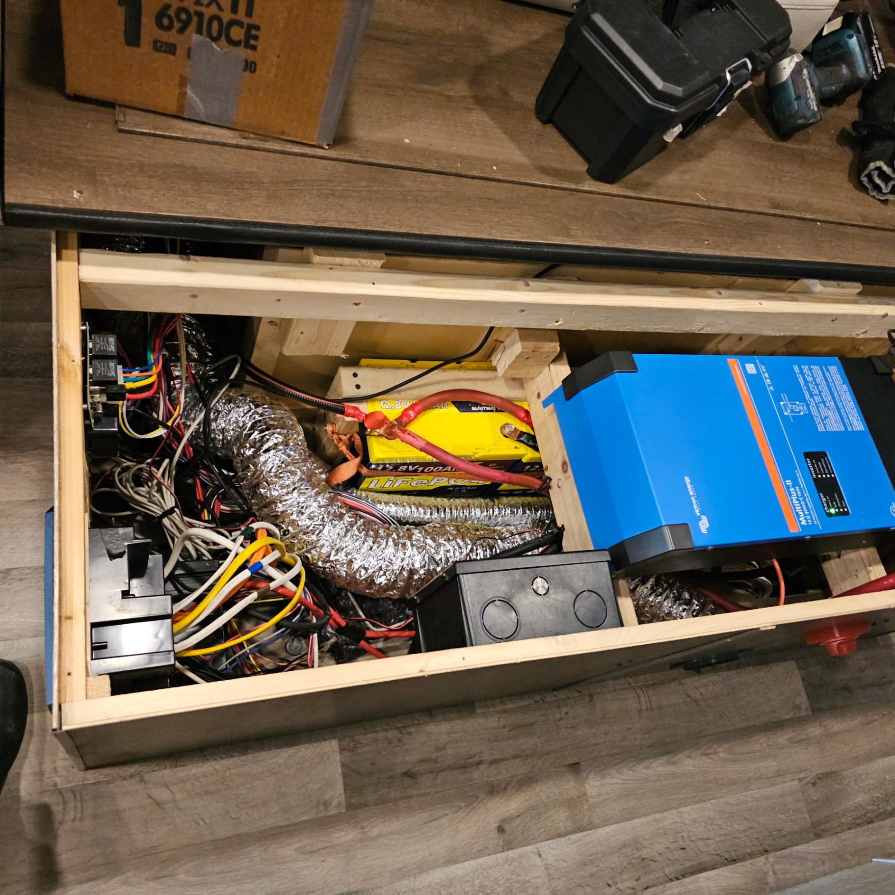 Under-bench electrical build in a van conversion