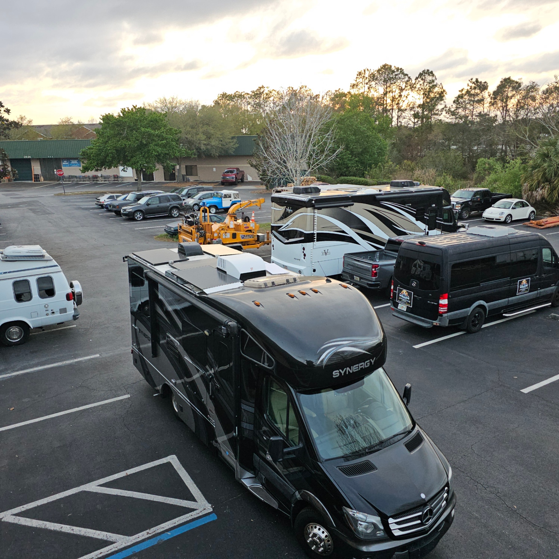 Shop overview at sunset — multiple rigs in progress